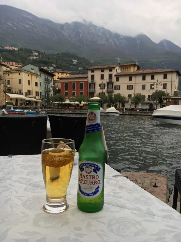 Drinking beer next to Lake Garda in Malcesine harbour